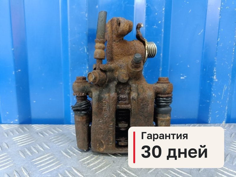 Суппорт Nissan Primera P11 1.8 QG18DE 2000 задн. прав. (б/у)