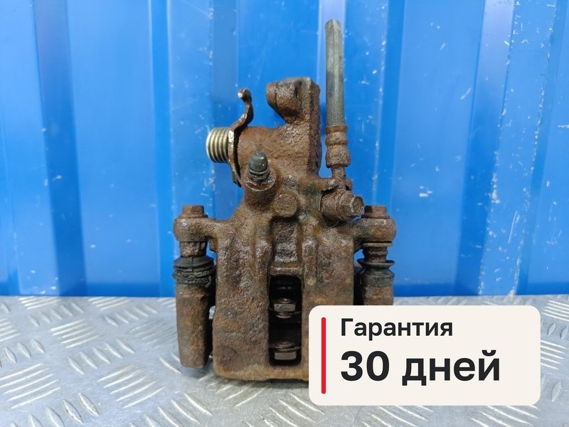 Суппорт Nissan Primera P11 1.8 QG18DE 2000 задн. лев. (б/у)