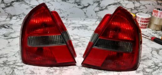 Запчасть фонарь задний левый Mitsubishi Carisma 1999-2003