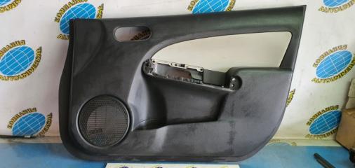 Обшивка двери передняя правая Mazda Demio 2008